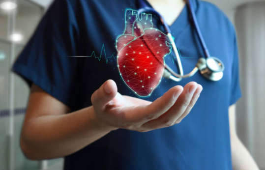 Healthcare professional holding a digital heart graphic representing medical research on the connection between gum disease and heart disease