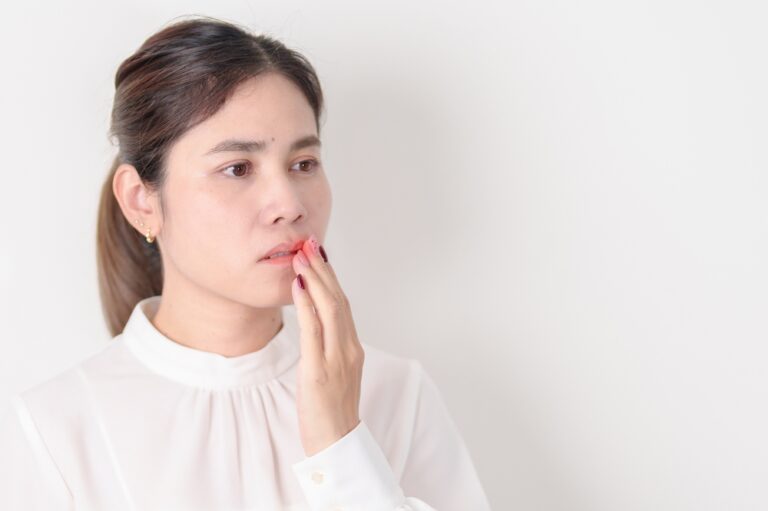 Business woman having Mouth ache for concepts of Mouth Ulcer Sore, Aphthous Stomatitis, Oral Lesions, Halitosis, Oral Health Care, Toothache and Gum Disease, Dental Caries, Gingivitis and Periodontal