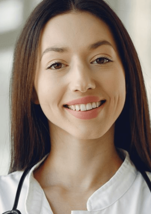 A smiling physician in a white coat with a stethoscope representing the connection between medical and oral health